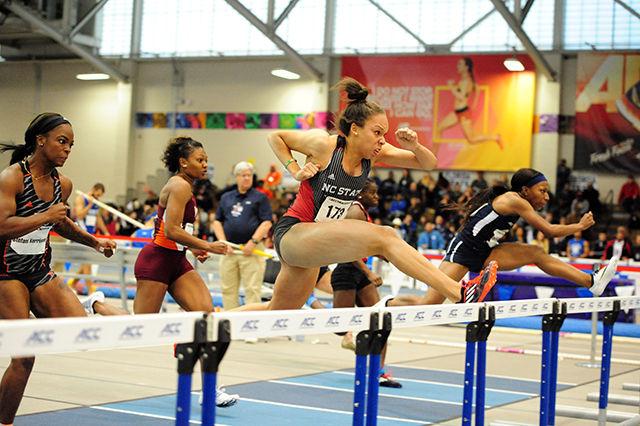 Alexis Perry hurdles during the 60-meter event of the same name. Perry brought home third with a personal record time of 8.21 seconds. The mark also moved Perry up to No. 17 nationally in the event.
