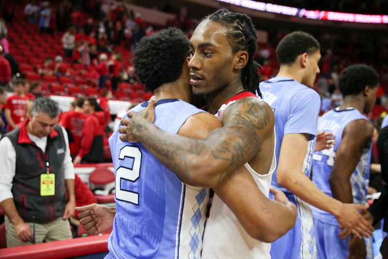 Junior Guard Anthony "Cat" Barber congratulates the UNC team on a good game after the final buzzer sounds. Barber finished with 32 points on 12-26 shooting, three assists, four turnovers, one steal, and six rebounds. The NC State Wolfpack lost to the UNC tarheels, 80-68, at PNC Arena on February 24, 2016.