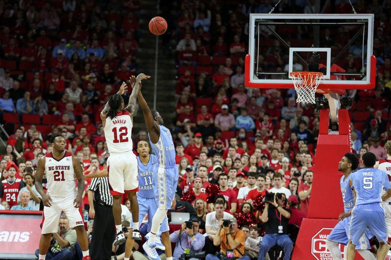 Junior Guard Anthony "Cat" Barber shoots a contested deep midrange shot in the second half with time winding down. The NC State Wolfpack lost to the UNC tarheels, 80-68, at PNC Arena on February 24, 2016.