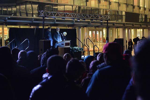 Farris Barakat, Deah's older brother, stands on the stage after speaking to those assembled for the memorial. Farris was one of several speakers last night, Wednesday, Feb 10, 2016, at the memorial to talk about the legacy that his younger brother and sisters-in-law have left the NC State community.