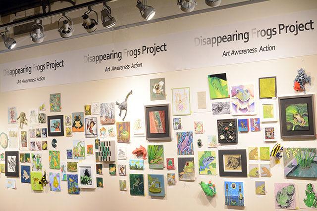 Paintings and other artwork featuring frogs at risk of extinction line up the walls of the Disappearing Frogs Project exhibit at the Crafts Center Monday, Feb. 8, 2016. The exhibit, which opened February 1st and runs through March 3rd, features nearly 200 pieces of art valued from $20 to $55 donated by local artists, N.C. State students as well as artists as far as Canada and Alaska. According to Assistant Director of the Crafts Center Jo Ellen Westmoreland, the Disappearing Frogs Project was started by artist Terry Thirian and the goal of the project is to use art to make people more aware of the frogs' plight worldwide and to raise money for the Amphibian Survival Alliance.