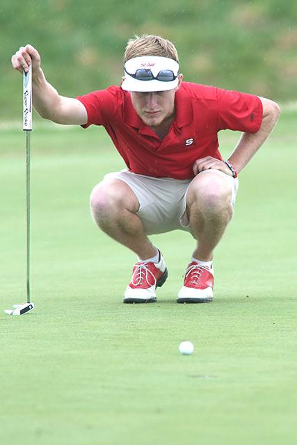 Junior David Cooke lines up for a putt on the 17th hole during the Spring Invitational. NC State took first place of 11 with a -17 overall and Cooke took first place individual with a -10 on Sunday April 19th at the Loonie Poole Golf Course.