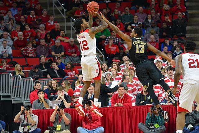 Junior guard Anthony "Cat" Barber attempts to make a shot during the basketball game versus Wake Forest on Saturday, Feb. 13, 2016. Barber scored a career-record 38 points, leading the Wolfpack to victory 99-88.