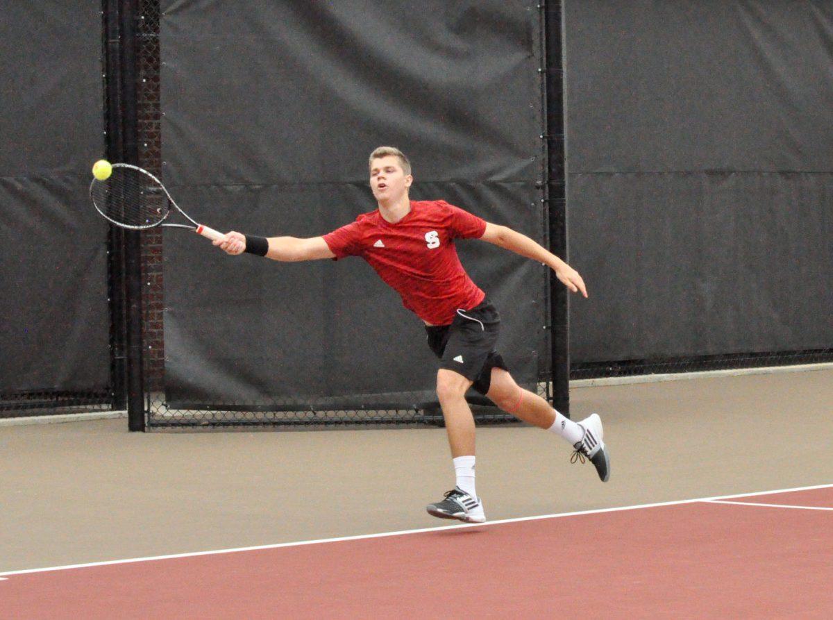 Junior Thomas Weigel returns a serve from Virginia Tech senior Florian Nicoud. Weigel defeated Virginia Tech's Nicoud 6-3, 6-2. The Wolfpack lost the match 4-3 to the 16th-ranked Hokies at J. W. Isenhour Tennis Center on March 22, 2015.&#160;
