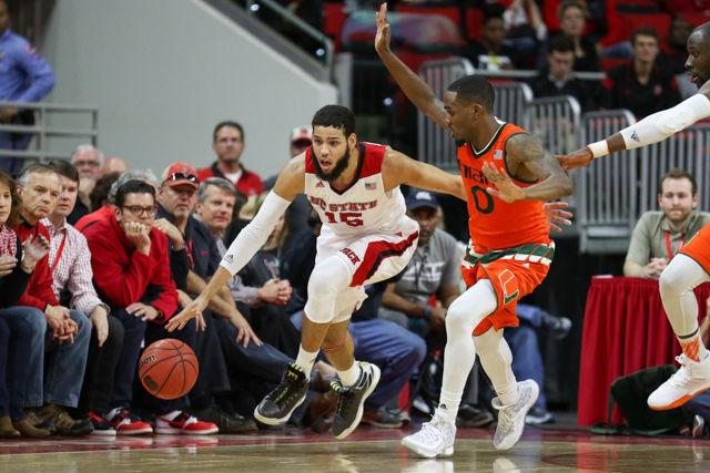 Sophomore guard/forward Cody Martin sprint up the court around a Miami defender in the second half while Miami tries to full court press in the closing minutes. Cody Martin finished the game with eight points on 3-4 shooting including four assists and a rebound. The Wolfpack beat the Miami Hurricanes 85-69 on January 30th, 2016 at PNC Arena.
