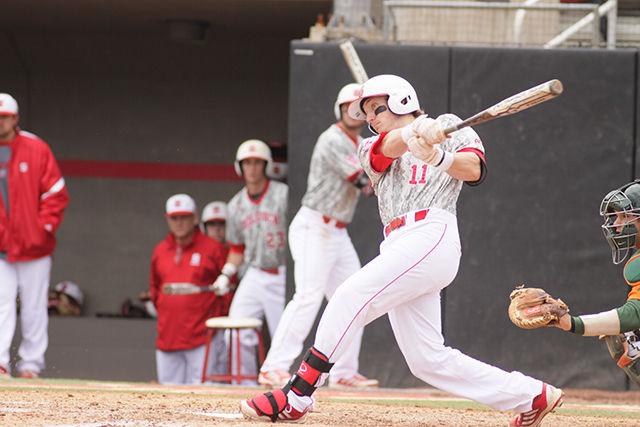 Freshman third baseman Andrew Knizer bats during N.C. State loss to Miami on Sunday March 31 2014. The 12-5 loss made the Wolfpack's record 15-11 overall and 3-9 in the ACC. The team's next home appearance will be on April 18 Boston College at 6:30pm. Photo by Joannah Irvin.