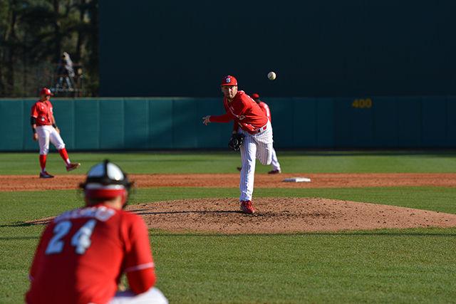 Brian Brown, a sophmore pitcher, warms up between innings during the game against Wright State. Brown would only allow three hits and two walks during the game on Saturday, Feb 27, 2016 at Doak Field at Dail Park, allowing the Wolfpack to win 6-1.