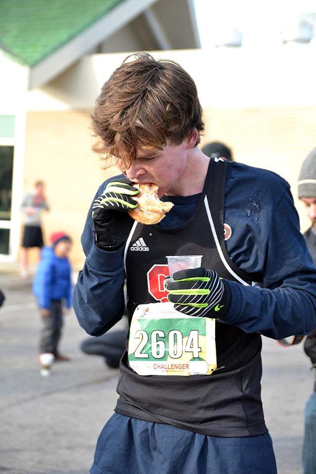 Blake Lassiter, a junior studying management, eats multiple doughnuts squished together as part of the Kripsy Kreme Challenge where Lassiter ate a dozen on Saturday, Feb. 6th, 2016.
