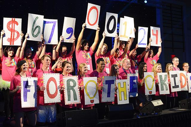 The organizers of the 2015 Dance Marathon at NC State revealing the final amount of money raised by the dancers Friday night in the Talley Ballroom. Dance Marathon is a yearlong fundraising effort for the Children's Miracle Network Hospital, Duke Children's Hospital and Health Center in Durham, NC. The total donation was $67,001.24.