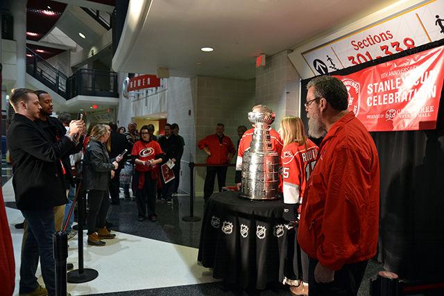 Carolina Hurricanes fans line up to get the opportunity to take a photo with the Stanley Cup, ten years after the Hurricanes Stanely Cup win, Friday, Feb 12, 2016.