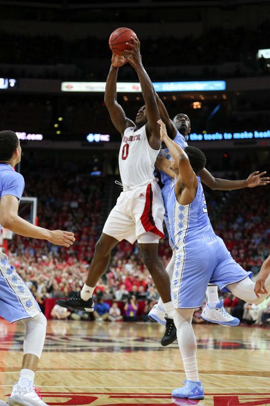 Abdul-Malik Abu grabs a rebound over two UNC defenders in the first half. The NC State Wolfpack lost to the UNC tarheels, 80-68, at PNC Arena on February 24, 2016.