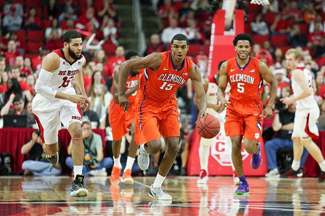 A Clemson player steals it in the second half and scores a layup during the Clemson vs NC State basketball game at PNC Arena on February 20, 2016.