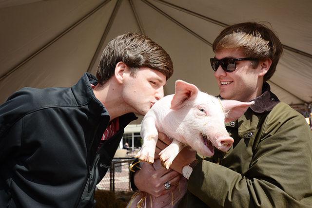 n a competition sponsored by Alpha Zeta agricultural fraternity, participants with the most money in their jars had to kiss a pig. Rusty Mau, a senior studying economics and student body president candidate, and Devan Riley, a junior studying accounting and student body vice president candidate, kiss Murphy Lee Sausage Jr. March 24, 2014.&#160;