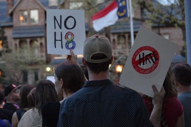 Roughly 1000 protesters gathered in front of the Governor's Mansion to protest the passage of HB2 on Thursday, March 24, 2016. Passing HB2 prevents local governments from passing anti-discrimination rules -- significantly impacting those that identify as transgender and non-gender-conforming peoples. Signs that were displayed during the protest included, "NO H8", "PRIDE DOESN'T HIDE", and "QUEER + TRANS BLACK LIVES MATTER".