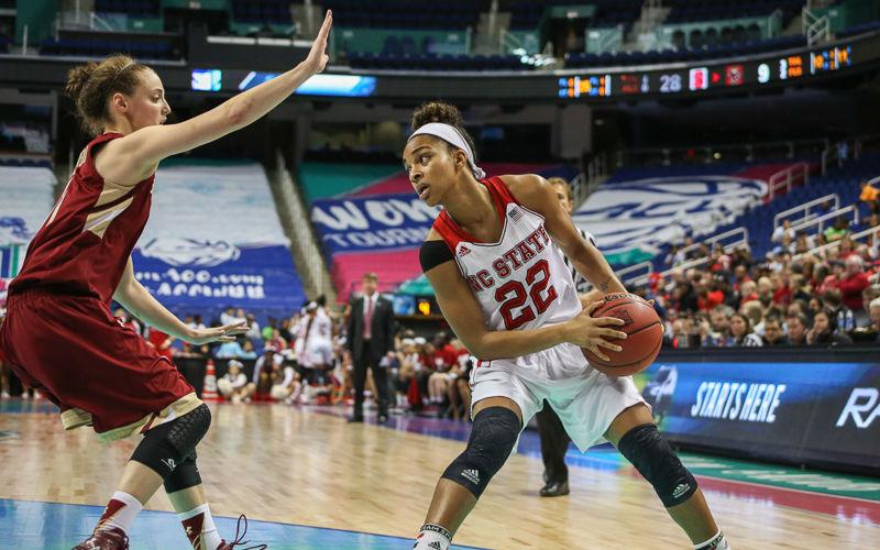 Redshirt junior guard Dominique Wilson prepares to make a move around the Boston College defense. Wilson had 14 points on the day and put up a stat in every major category helping the Wolfpack soar over the Eagles 76-60 in game seven of the Women's ACC Tournament on March 3rd, 2016 at the Greensboro Coliseum.