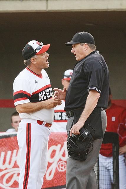 Head coach Elliot Avent discusses a play with the umpire. The NC State baseball team lost to Indiana State 11-7 at Doak Field on March 16.