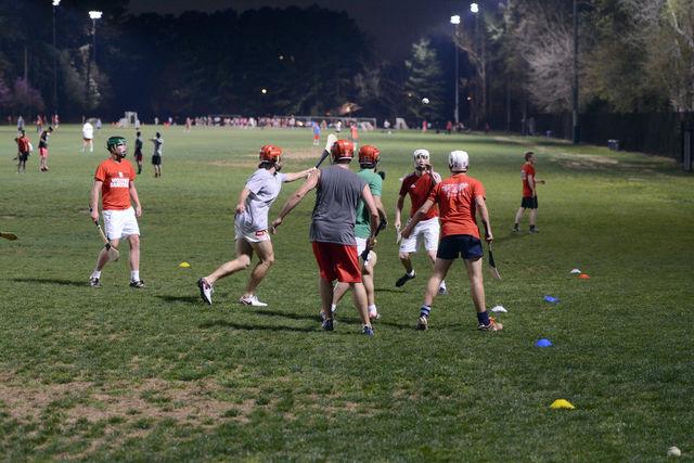 Members of the Gaelic Athletics Association practice hurling at Miller Fields Tuesday evening, March 15, 2016. The Gaelic Athletics Association practices Tuesday evenings and Friday afternoons.