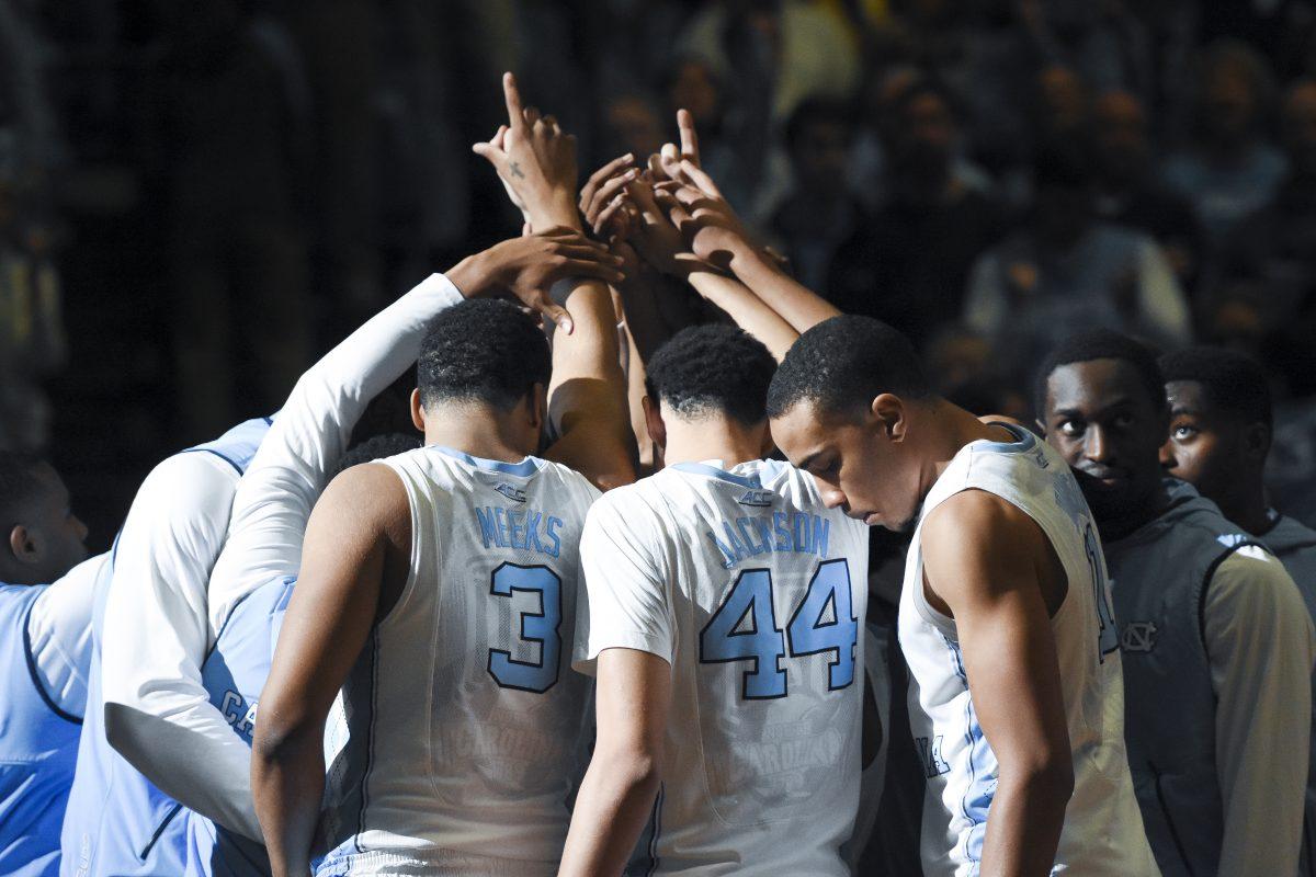 The Tarheels huddle up during the opening ceremony on January 16th in the Dean Dome. The Wolfpack suffered a 67-55 loss marking there 5th consecutive conference lost.
