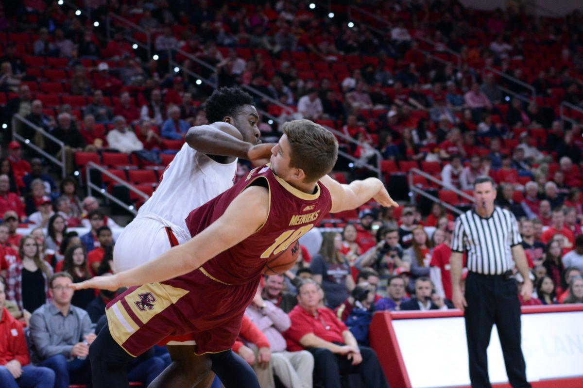 Sophomore forward Abdul-Malik Abu fouls freshman forward Ervins Meznieks from Boston College during the second half of the basketball game at PNC Arena on Wednesday, March 2, 2016.