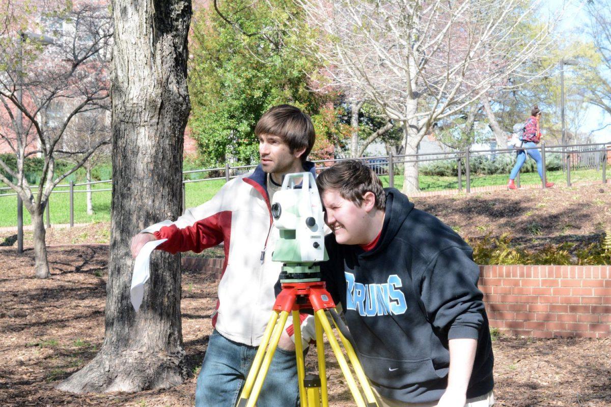 David Schoch, a senior in construction engineering, and Ian Pike, a senior in civil engineering, finish up a surveying project in their surveying lab on Monday, March 21st. "Basically, we are surveying the land around campus by gathering information about elevations and distances between points on campus with these total stations," stated Schoch. Total stations are surveying instruments that use a movable telescope to measure angles in both vertical and horizontal planes of view. Schoch and Pike both agreed that that surveying labs are pretty tough, but the experience they gain will be very helpful as they graduate and pursue careers in their respective engineering fields.