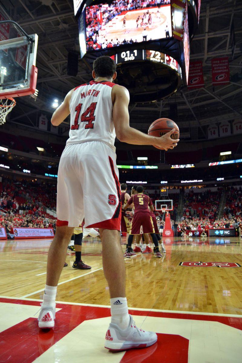 Sophomore forward Caleb Martin waits for a team member to be open to pass the ball to with only 1.1 seconds left in the game at PNC Arena on Wednesday, March 2, 2016.