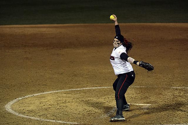 Sophomore Harli Hubbard, pitcher, winds up to pitch to a member of the opposing team. NC State's softball team played against UNC Charlotte on March 2nd at Dail Softball Stadium. NC State won the game 6-5.