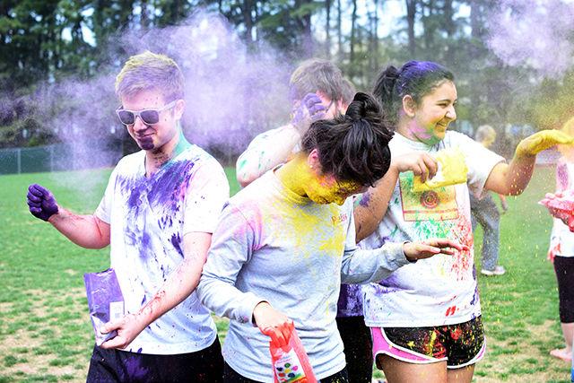 Students group together and throw colored powder on each other during Holi, an event that took place on 19 March, 2016 on Lee Field. The event was cohosted by Maitri, Ektaa, and Kappa Phi Lambda.