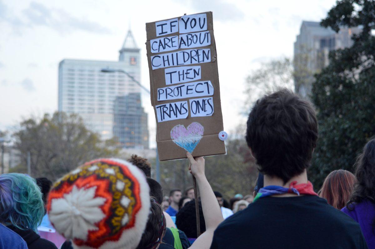 Roughly 700 protesters gathered in front of the Governor's Mansion to protest the passage of HB2 on Thursday, March 24, 2016. Passing HB2 prevents local governments from passing anti-discrimination rules -- significantly impacting those that identify as transgender and non-gender-conforming peoples. Signs that were displayed during the protest included, "NO H8", "PRIDE DOESN'T HIDE", "QUEER + TRANS BLACK LIVES MATTER", and "IF YOU CARE ABOUT CHILDREN, THEN PROTECT TRANS ONES" -- directly challenging the McCrory Campaign's statement which read: "Standing with North Carolina parents who are worried about the privacy and safety of their children will always be a top priority for the governor, no matter the spin by the media, pundits or politically correct crowd."