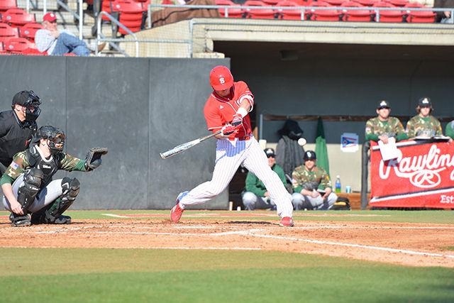 Chance Shepard, a senior catcher, hits a homerun during the bottom of the second inning of the game against Wright State Feb. 27 at Doak Field. Shepard's homerun was the first run on the board for the Wolfpack Saturday, and the team went on to win 6-1.