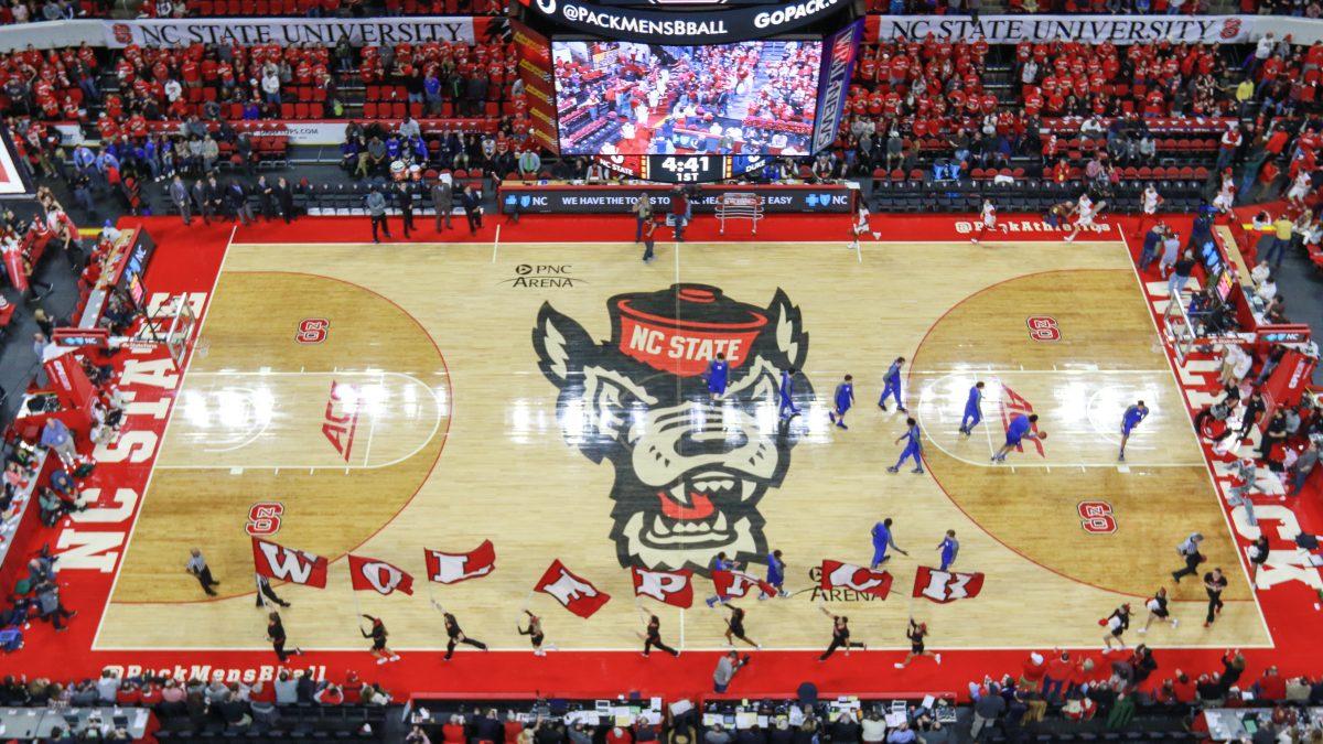 The cheer squad rushes across the floor with Wolfpack flags as the team enters the court prior to tipoff in a 88-78 loss to Duke on Jan. 23 in PNC Arena.