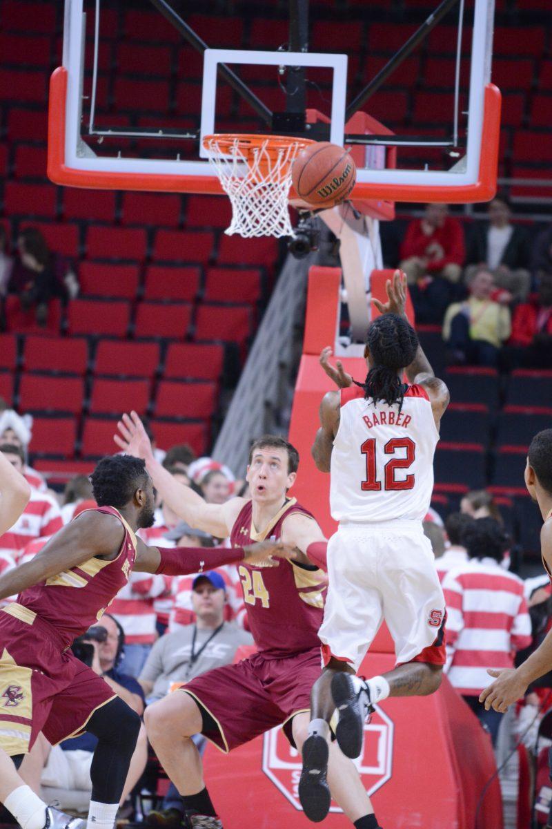 Junior guard Anthony "Cat" Barber attempts to score at the beginning of the first half of the basketball game against Boston College at PNC Arena on Wednesday, March 2, 2016. Abdul-Malik rebounds and dunks the ball for the first two points in the first 11 seconds.