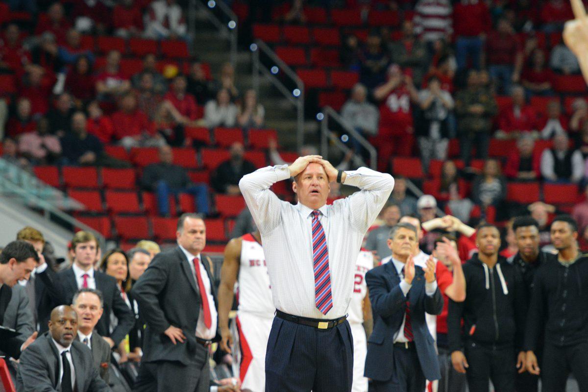 Head Coach Mark Gottfried looks on with trepidation as the Wolfpack falls behind early in the second half of the game Wednesday night, March 2, 2016. The Wolfpack went on to win 73 to 72 against Boston College in PNC Arena in the last home game of the season.