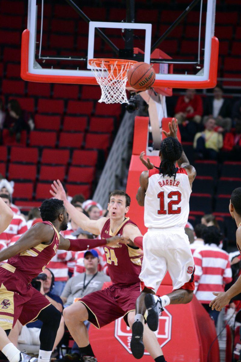 Junior guard Anthony "Cat" Barber attempts to score at the beginning of the first half of the basketball game against Boston College at PNC Arena on Wednesday, March 2, 2016. Abdul-Malik rebounds and dunks the ball for the first two points in the first 11 seconds.