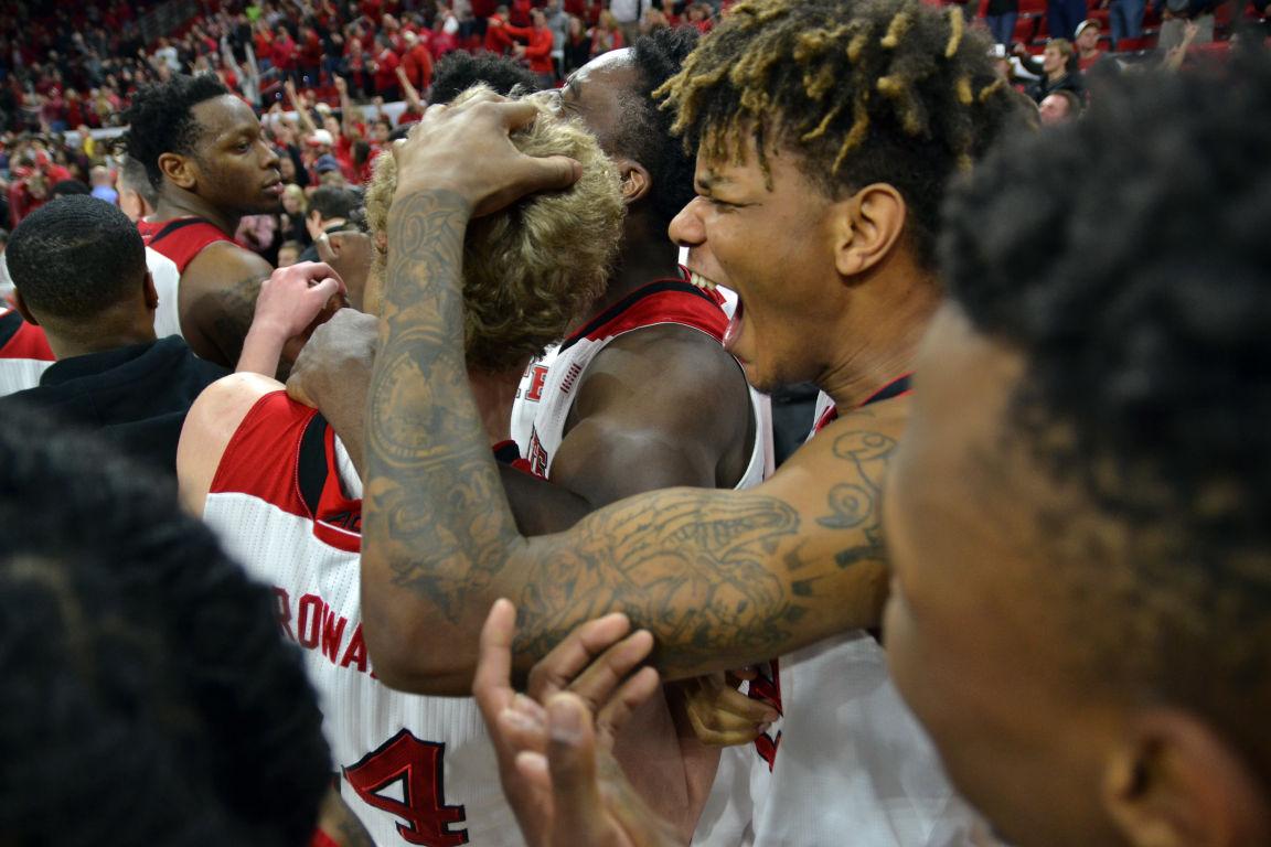 Freshman guard Shaun Kirk celebrates as it's announced that freshman forward Maverick Rowan's final shot counted in time for the Wolfpack to win 73-72 against Boston College on Wednesday, March 2, 2016, at PNC Arena.