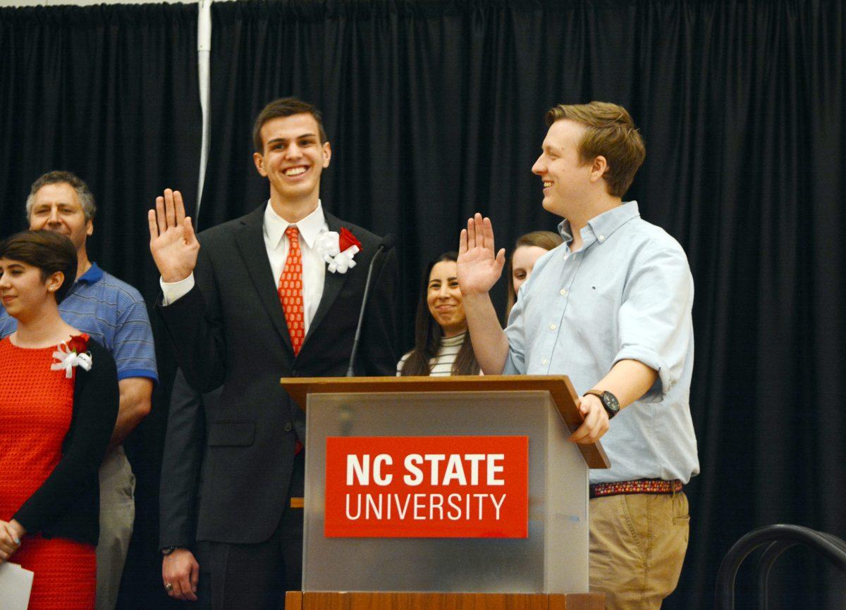 Gavin Harrison, Chair of Elections, swears in new student body president Paul Nolan during the Student Body Officer Induction. After neither the Nolan/Stafford pair nor the Long/Moravec received more than 40% of the vote during the General Election, a Runoff Election was held, where Nolan won with 1587 votes, 56% of the votes cast.