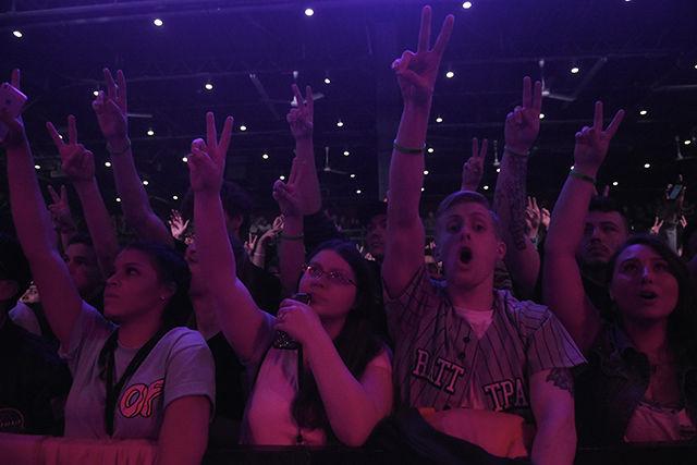 Fans in the crowd throw up the peace sign during Dj Rhetorik's on March 19th to during The Incredible World Tour.