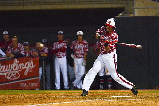 Sophomore infielder Stephen Pitarra swings for a single. NC State men's baseball team beat UNC-Greensboro 8-4 at Doak field in Dail Park on March 1st.