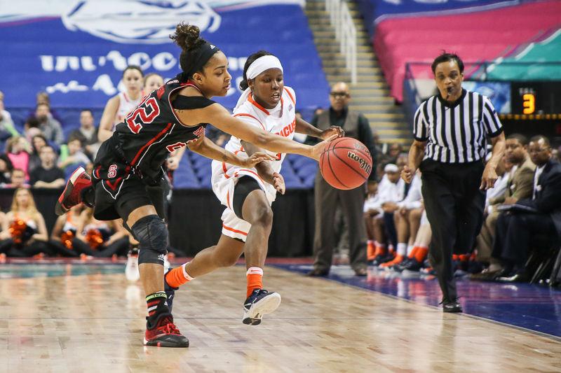 Redshirt junior guard Dominique Wilson makes a fast break down court, neary losing the ball in the process but mainting possesion. Wilson struggled offensively only putting up eight points, but lead the team in steals and assists while grabing six boards. The Wolfpack struggled against the No. 17 Syracuse 3-pt 44.4% accuracy leading to a 80-61 quarterfinal loss on March 4th, 2016 at Greensboro Coliseum.