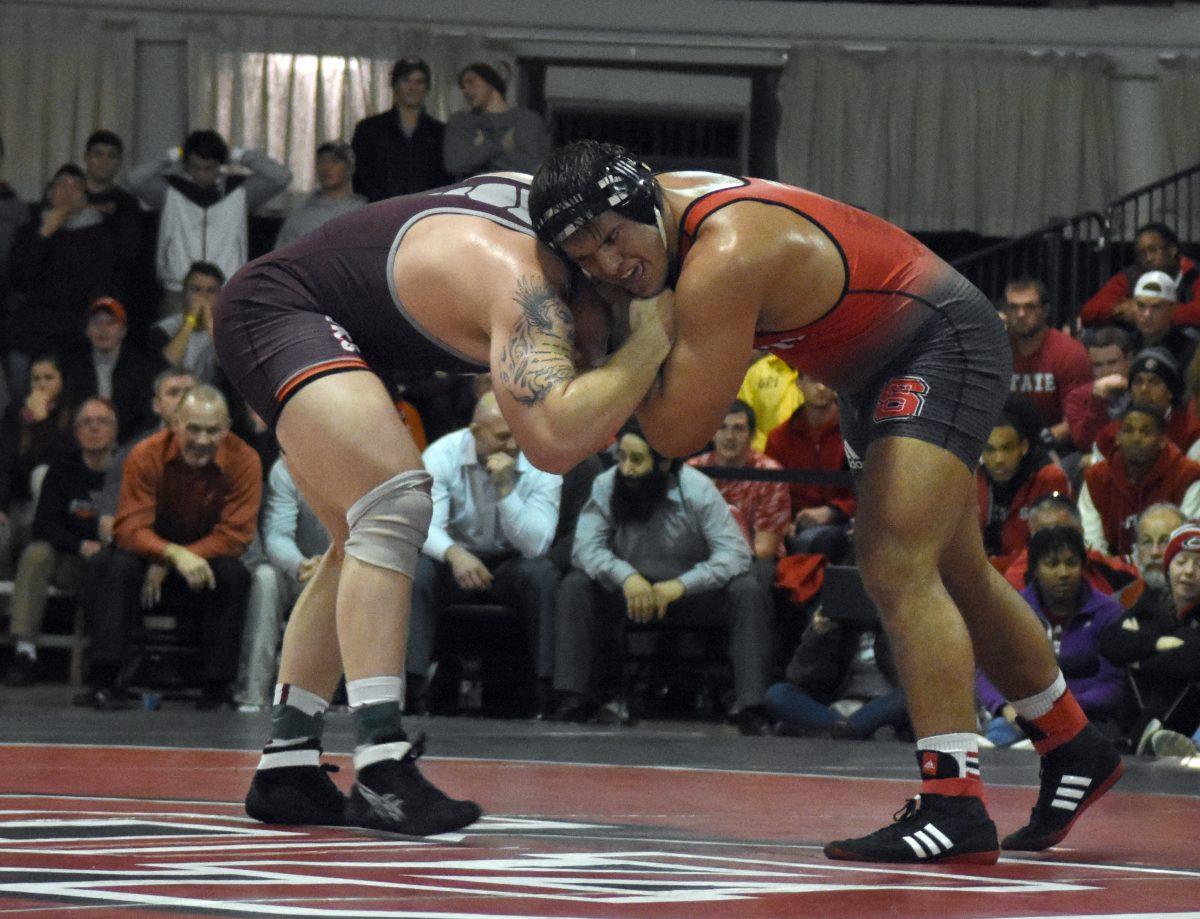 Redshirt senior and two time national champion Nick Gwaizdowski hand fights with his opponent during the Virginia Tech dual meet. By the end of the meet, the Hokies were declared the winners by a score of 19-14 in the Holshouser Building Feb. 12.