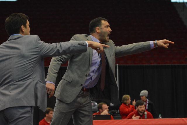 Head coach Pat Popolizio screams for the officials to make a call in the Wolfpack's meet against No. 17 Virginia on Jan. 17. The Wolfpack was able to defeat Virginia 35-7 losing only two bouts in the meet held at Dorton Arena.