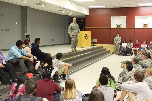 Students listen to an officer while he motivates the NC State community to stop and protest against sexual assaults. "Go out there and let those people know that sexual assault would not be tolerated," he says. Many students gathered at the Witherspoon Student Centre to support the Take Back the Night event annually organized by Women's Centre on Thursday, April 9, 2015. The event was aimed to create awareness about sexual assaults and provide a decent platform to the victims to share their stories and get support from the NC State community.