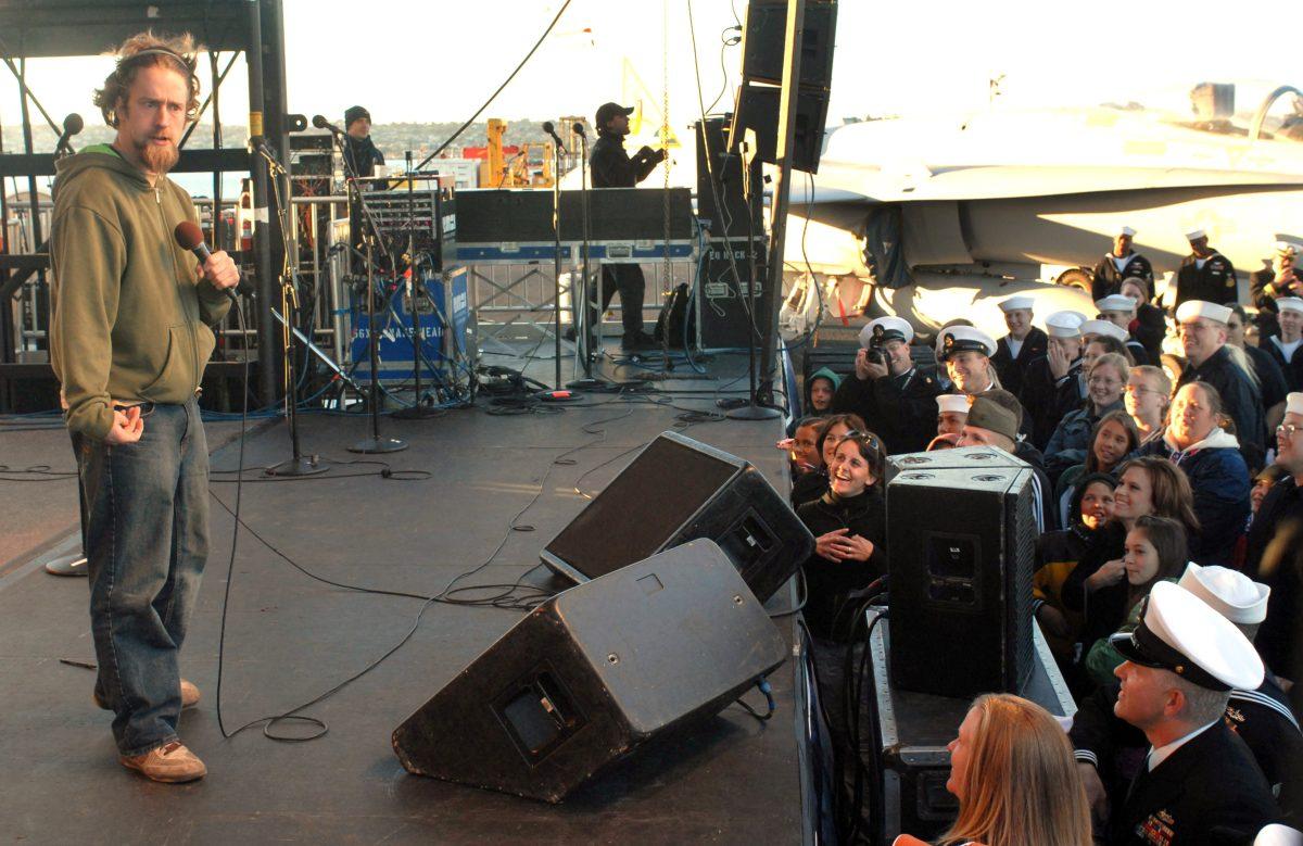 On Dec. 19, 2006, winner of the television program "Last Comic Standing" Josh Blue gets the crowd laughing during a holiday concert aboard the Nimitz-class aircraft carrier USS Ronald Reagan. The United Service Organizations sponsored the event that featured recent American Idol winner Taylor Hicks. The event was open to all service members and their families in the San Diego area.