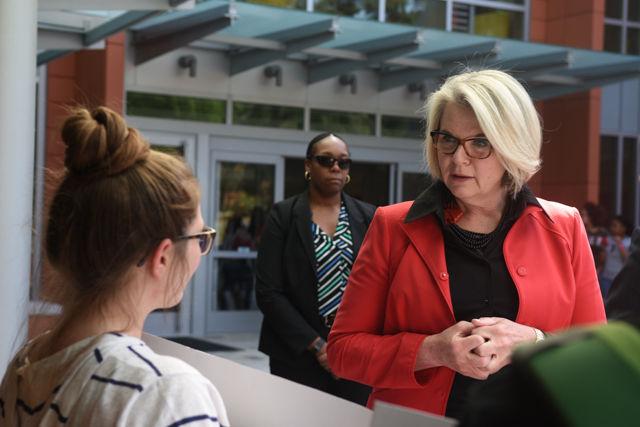 Maragaret Spellings, former secretary of education and current president of the UNC System, speaks with Hannah Fennell, a junior studying applied mathmatics, during her visit to North Carolina State University on April 20, 2016. Fennell was one of the students protesting Spellings appointment as president.
