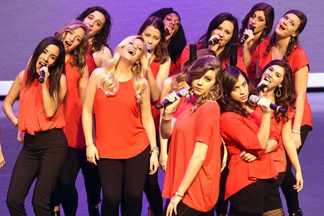 Holleigh Rowe, a senior studying marketing, and Tianna Soto, a senior studying psychology and Spanish literature/language, pose as the rest of Ladies in Red sing "Before He Cheats" during the Ladies in Red spring concert April 6. The concert featured music from a variety of genres including pop, R&amp;B, oldies, country, indie and alternative.