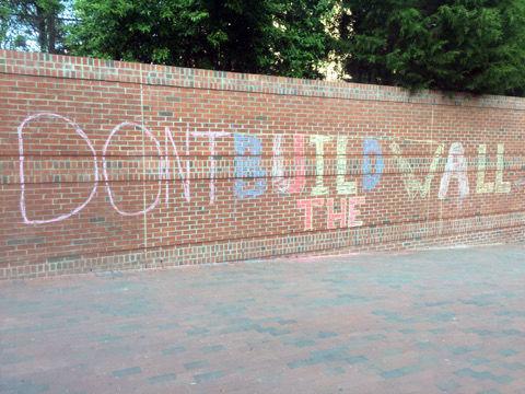 "BUILD THE WALL" is written on the wall leading out of the Free Expression Tunnel on Monday, April 18, 2016. Another person added "DON'T" in front of the message. Chalking is prohibited on vertical surfaces.&#160;