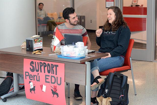 Calli Brown, a senior in biological sciences, and Michael Knepper, a senior in environmental engineering, sell raffle tickets to raise money for Peru EDU in Talley Student Union on Monday, April 4th. Peru EDU is an organization at NC State that is dedicated to supporting an impoverished school in rural Peru where children, up until recently, didn't have access to basic school necessities. With the help of Peru EDU and the summer study abroad program that the organization is partnered with, sanitary bathrooms, electricity and more have been supplied to the school. The money currently being raised is going towards providing a copier/printer to the students so that they may take their education even further.