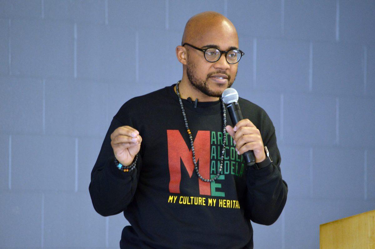 Jonathan Butler, a University of Missouri-Columbia graduate and the man behind the Mizzou Hunger Strike, speaks to the crowd in the Sankofa Room in Witherspoon Student Center during TUFF Talks on Monday, April 4, 2016. "The most common way people give up their power, is not knowing that they have any." TUFF Talks, an event sponsored by Black Students Board of Union Activities Board and reminiscent of TED Talks, is a part of the Pan-Afrikan Week 2016. The theme for this year's Pan-Afrikan Week is "Rooted": honoring and affirming the importance of culture and the celebration of community. Butler stated, "If we don't come together, there's no point in fighting because it will fail. If we don't actually try and do something for our future, we're ensuring our demise."