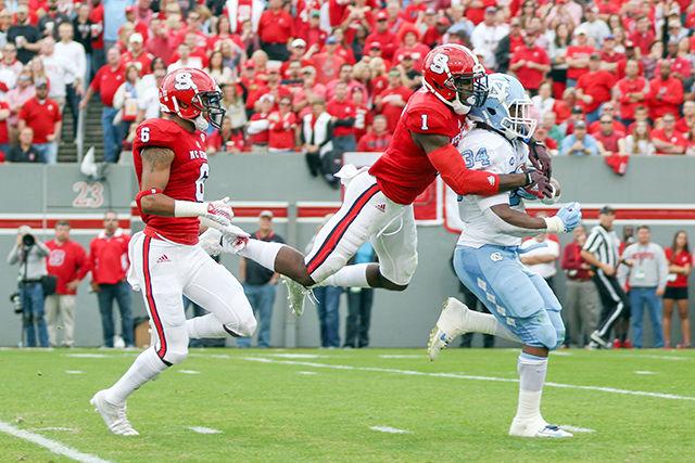 Graduate safety Hakim Jones makes a diving tackle to stop a UNC touchdown in the first quarter. Jones finished with four solo tackles and six total tackles. The NC State Wolfpack fell to the Tar Heels, in the last home game of the season, 45-34 at Carter-Finley Stadium Nov. 28.