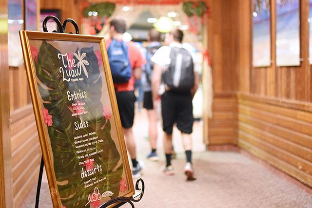 A sign for Laua Night, fountain's hawaiin themed dinner, sits infront of the lobby as students enter the hallway to one of the dinning areas. The menu at the dinner consisted of hawaiiain based cusine such as Baked Mahi, Spam Fried Rice and Hawaiin Stir Fry.