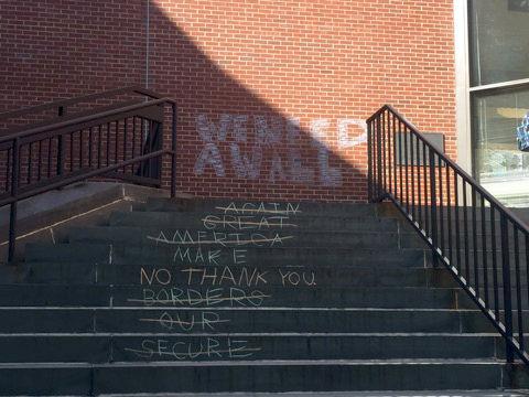 "SECURE OUR BORDERS" and "MAKE AMERICA GREAT AGAIN" crossed out the words "NO THANK YOU" on the steps leading up to Caldwell Lounge on Monday, April 18, 2016.